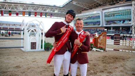 Daniel Deusser (L.) and Pius Schwizer of Shanghai Swans celebrate their win in Doha. 