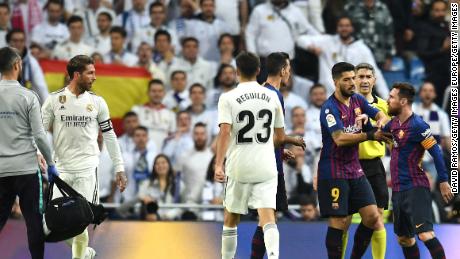 Lionel Messi reacts angrily to a challenge by Sergio Ramos as tempers flared in El Clasico. 