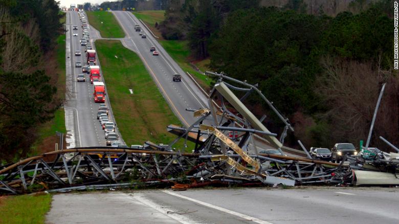 A fallen cell tower lies across U.S. Route 280 highway in Lee County, Alabama after what appeared to be a tornado struck in the area.