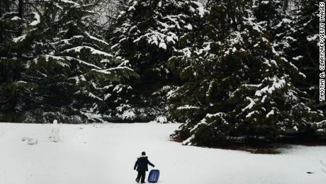 A boy sleds in Manhattan's Central Park on Monday after a late season snowstorm.