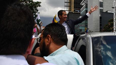 Opposition leader Juan Guaido returns to Venezuela, risking arrest 