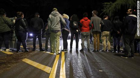 Protesters block an intersection to demonstrate the decision by Sacramento District Attorney not to charge the Sacramento police officers who shot and killed Stephon Clark last year. 