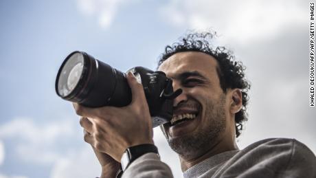 Egyptian photojournalist Mahmoud Abu Zeid, widely known as Shawkan, carries a camera at his home in the capital Cairo on March 4, 2019. - The award-winning photojournalist was released today after spending nearly six years in prison following his arrest while covering a bloody crackdown on protests, his lawyer said. Shawkan, last year received UNESCO's World Freedom Prize, dismaying the Egyptian authorities who accused him of &quot;terrorist and criminal acts&quot;. (Photo by Khaled DESOUKI / AFP)        (Photo credit should read KHALED DESOUKI/AFP/Getty Images)