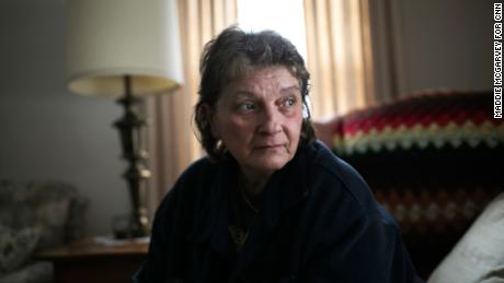 Tammy Vennitti sits in her friend's home in Newton Falls, Ohio. She was laid off and takes medicine to help with the stress of losing her job.