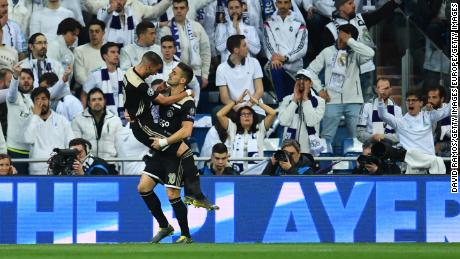 Hakim Ziyech celebrates Ajax's first goal with Dusan Tadic in front of the Real Madrid fans.