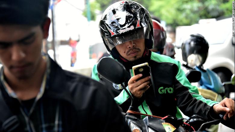 A GrabBike rider in Jakarta. Grab plans to use a lot of the recent money it has raised to beef up its business in Indonesia. Image: CNN Business