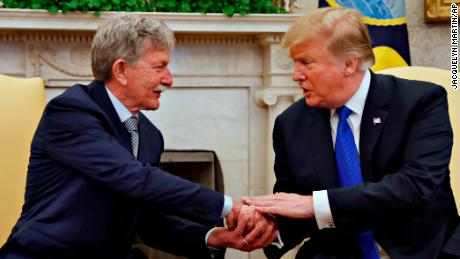 President Donald Trump, right, shakes hands with Danny Burch, a former U.S. hostage held in Yemen, Wednesday, March 6, 2019, in the Oval Office of the White House in Washington. (AP Photo/Jacquelyn Martin)