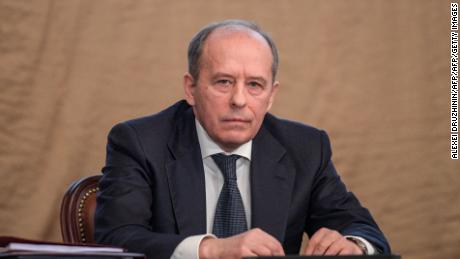 Alexander Bortnikov, director of the FSB, sat alongside Vladimir Putin as he delivered his speech. 