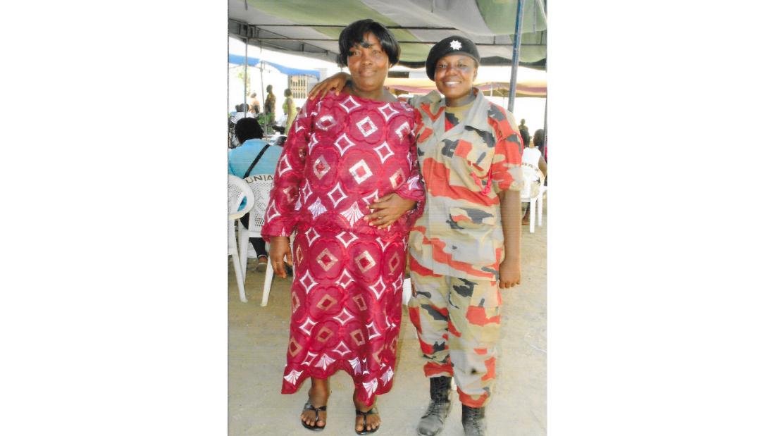 Thelma (right), with her mother, at her graduation from fire service training school. 