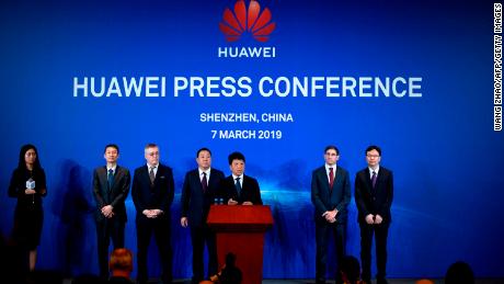 Huawei Deputy Chairman Guo Ping, center, announcing a lawsuit against the US government on Thursday.