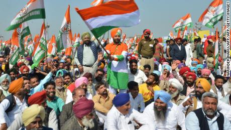 Congress party supporters hold party flags during the launch of the party&#39;s campaign in Punjab ahead of the upcoming elections.