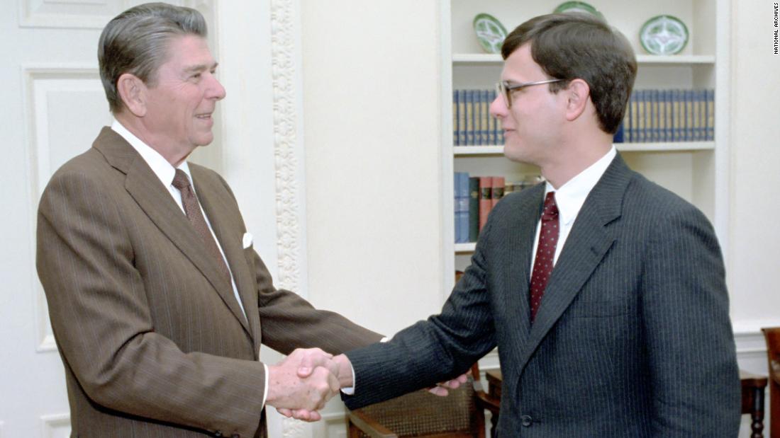Roberts shakes hands with US President Ronald Reagan in 1983. He was an associate counsel to Reagan from 1982-1986.