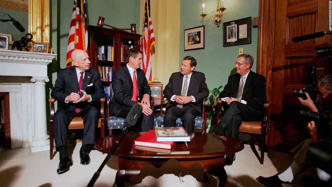 Roberts, third from left, meets with US senators in Washington a day after he was nominated by Bush. With Roberts, from left, are Sens. Arlen Specter, Bill Frist and Mitch McConnell.