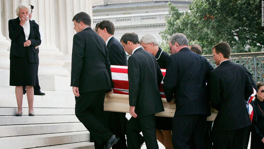 O&#39;Connor weeps as Roberts and other pallbearers carry Rehnquist&#39;s casket into the Supreme Court. Roberts was once a law clerk for Rehnquist.