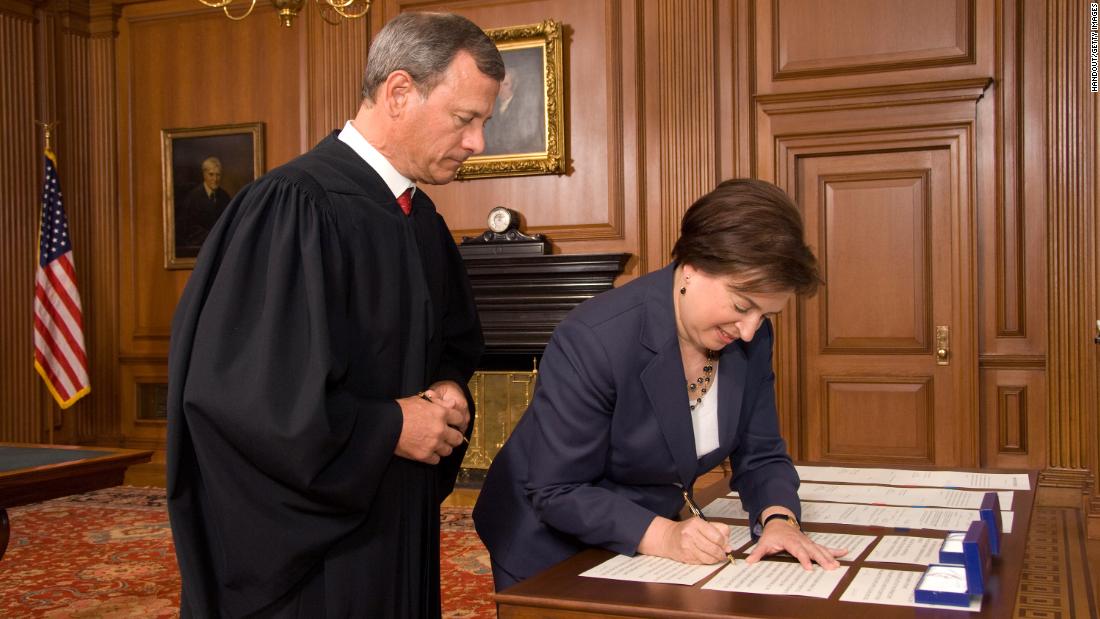 Roberts watches Elena Kagan sign the Oaths of Office after she replaced retiring Justice John Paul Stevens in 2010.