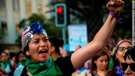 A Mapuche indigenous young woman takes part in a march on the International Women's Day in Santiago, on March 08, 2019. - Protests, strikes and studies -- people around the globe are taking action to mark International Women's Day and to push for action to to obtain equality. (Photo by Martin BERNETTI / AFP)        (Photo credit should read MARTIN BERNETTI/AFP/Getty Images)