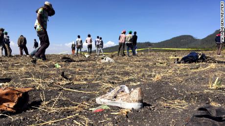 People walk at the scene of the Ethiopian Airlines Flight ET 302 plane crash, near the town of Bishoftu, southeast of Addis Ababa, Ethiopia March 10, 2019. REUTERS/Tiksa Negeri     TPX IMAGES OF THE DAY