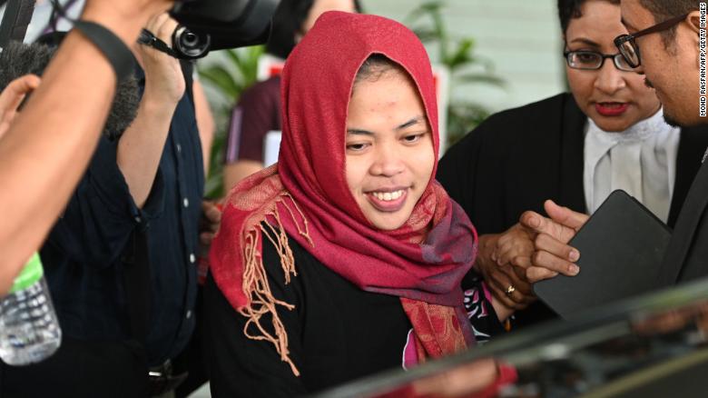Indonesian national Siti Aisyah (center) smiles while leaving the Shah Alam High Court Monday.