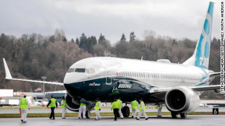 SEATTLE, WA - JANUARY 29: Members of the ground crew check out a Boeing 737 MAX 8 airliner after it landed at Boeing Field to complete its first flight on January 29, 2016 in Seattle, Washington. The 737 MAX is the newest generation of Boeing&#39;s most popular airliner featuring more fuel efficient engines and redesigned wings. (Photo by Stephen Brashear/Getty Images)