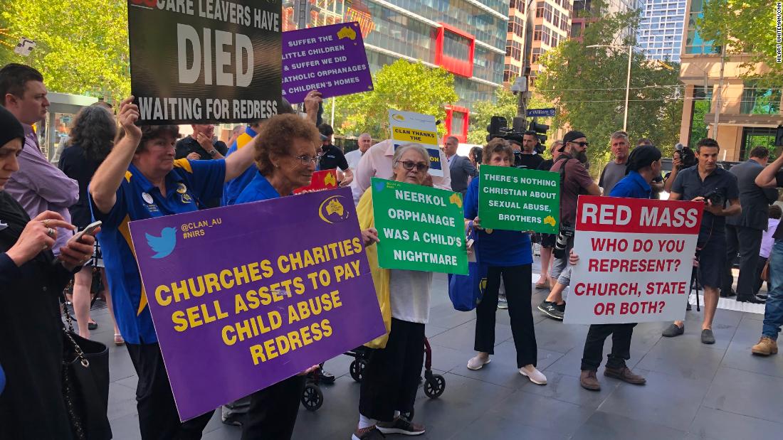 Protesters gathered with signs outside the court during Pell's pre-sentencing hearing in February, 2019.