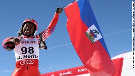 Marti waves her national flag at the finish area in St Moritz.