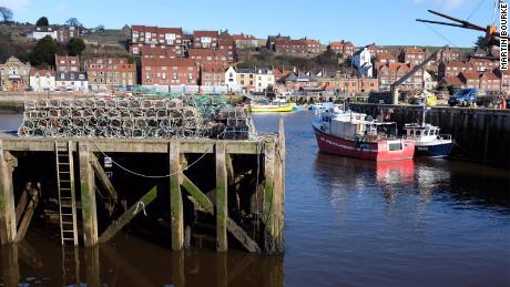 Whitby is a seaside town in northern England that's bisected by a long, narrow harbor. 