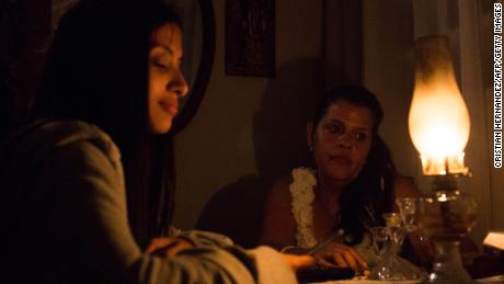 Venezuelan Yadira Delgado and her daughter Vanesa remain at their home in Caracas on March 9, 2019, during a massive power outage. - Sunday is the third day Venezuelans remain without communications, electricity or water, in an unprecedented power outage that already left 15 patients dead and threatens with extending indefinitely, increasing distress for the severe political and economic crisis hitting the oil-rich South American nation. 