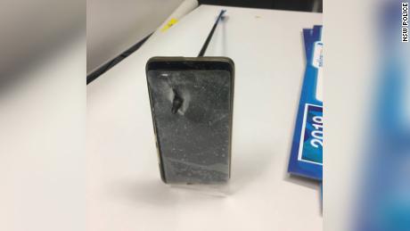 A photo from New South Wales police shows the smartphone which stopped an alleged attacker&#39;s arrow on Wednesday.