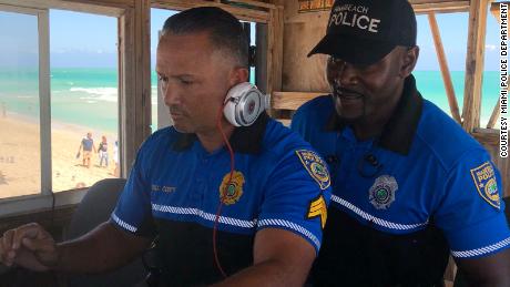 Miami police DJing in a lifeguard booth on Miami Beach in March 2018. 