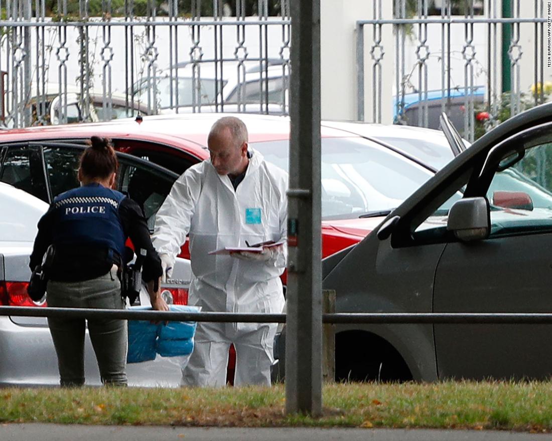 A forensics official works at the al Noor mosque after the attack.