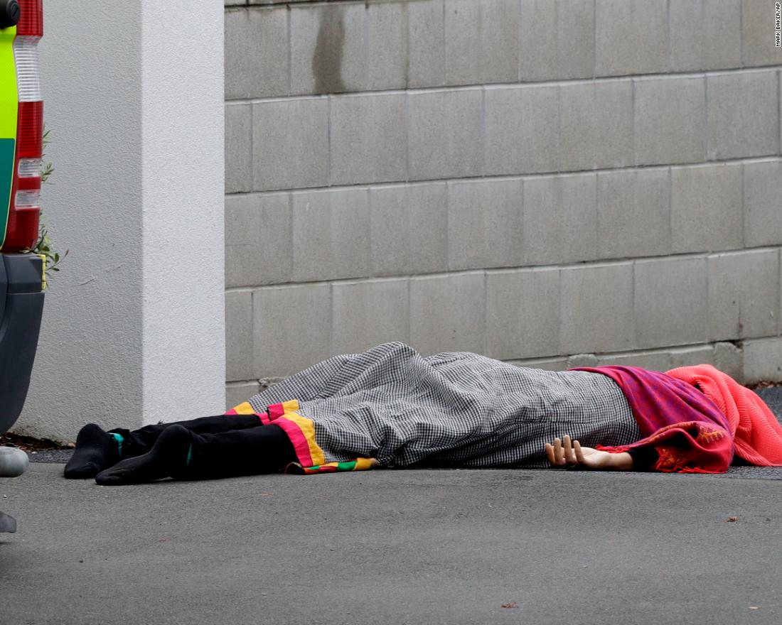 A body lies outside one of the mosques.