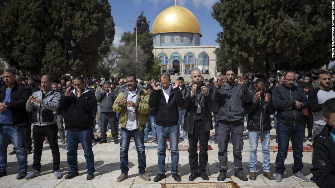 People pray for the victims at the al-Aqsa Mosque on Friday, March 15, in Jerusalem.