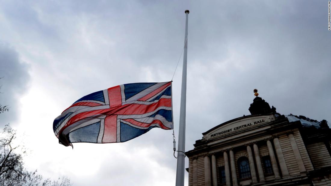 A flag flies at half-staff in London on March 15.