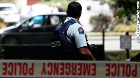 A police officer secures the area in front of the Masjid al Noor mosque after a shooting incident in Christchurch on March 15, 2019. - Attacks on two Christchurch mosques left at least 49 dead on March 15, with one gunman -- identified as an Australian extremist -- apparently livestreaming the assault that triggered the lockdown of the New Zealand city. (Photo by Tessa BURROWS / AFP)        (Photo credit should read TESSA BURROWS/AFP/Getty Images)