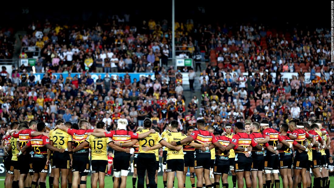 The Chiefs and Hurricanes gather together to remember the victims ahead of a professional rugby match in Hamilton, New Zealand.