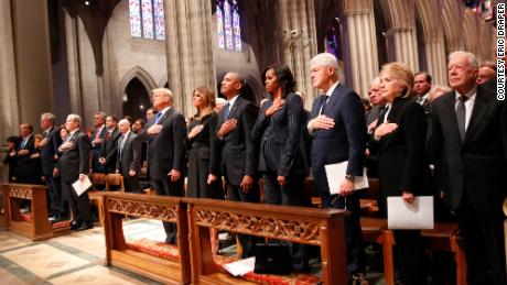 President Trump and four former presidents — George W. Bush, Barack Obama, Bill Clinton and Jimmy Carter and their wives hold their hands to their hearts at George H.W. Bush&#39;s memorial service in Washington.