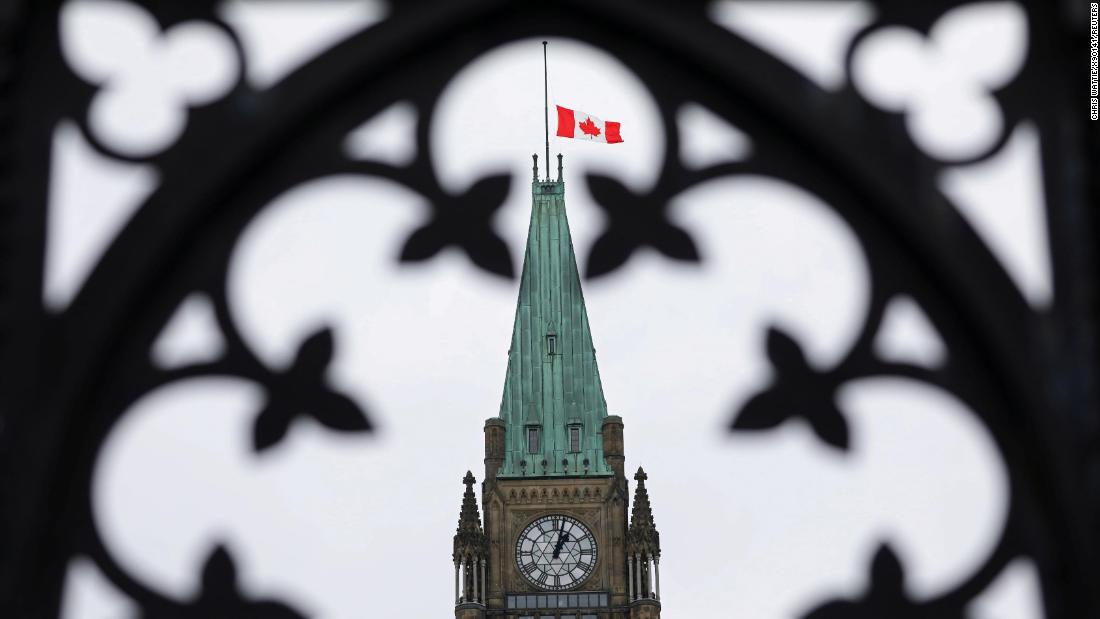 The Canadian flag flies at half-staff on the Peace Tower in Ottawa.