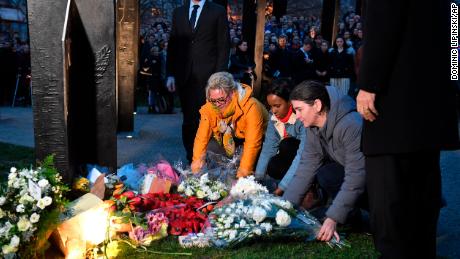 People taking part in a vigil at the New Zealand War Memorial at Hyde Park Corner in London.