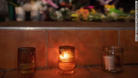 Flowers and candles on the front steps of the Kilbirnie Mosque in Wellington, New Zealand, on Friday.