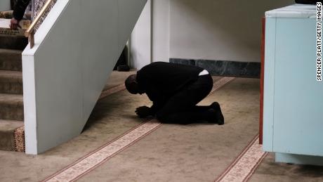 A man prays in a mosque in Manhattan after a terror attack at two mosques in New Zealand on March 15.