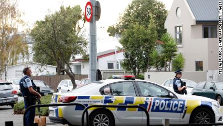 Police officers secure the area in front of the Masjid al Noor mosque after a shooting in Christchurch on Friday. 