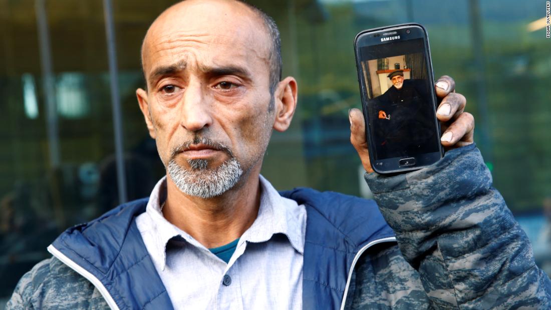 Omar Nabi, standing at the district court in Christchurch, speaks to the media about losing his father, Haji Daoud, in the mosque attacks.