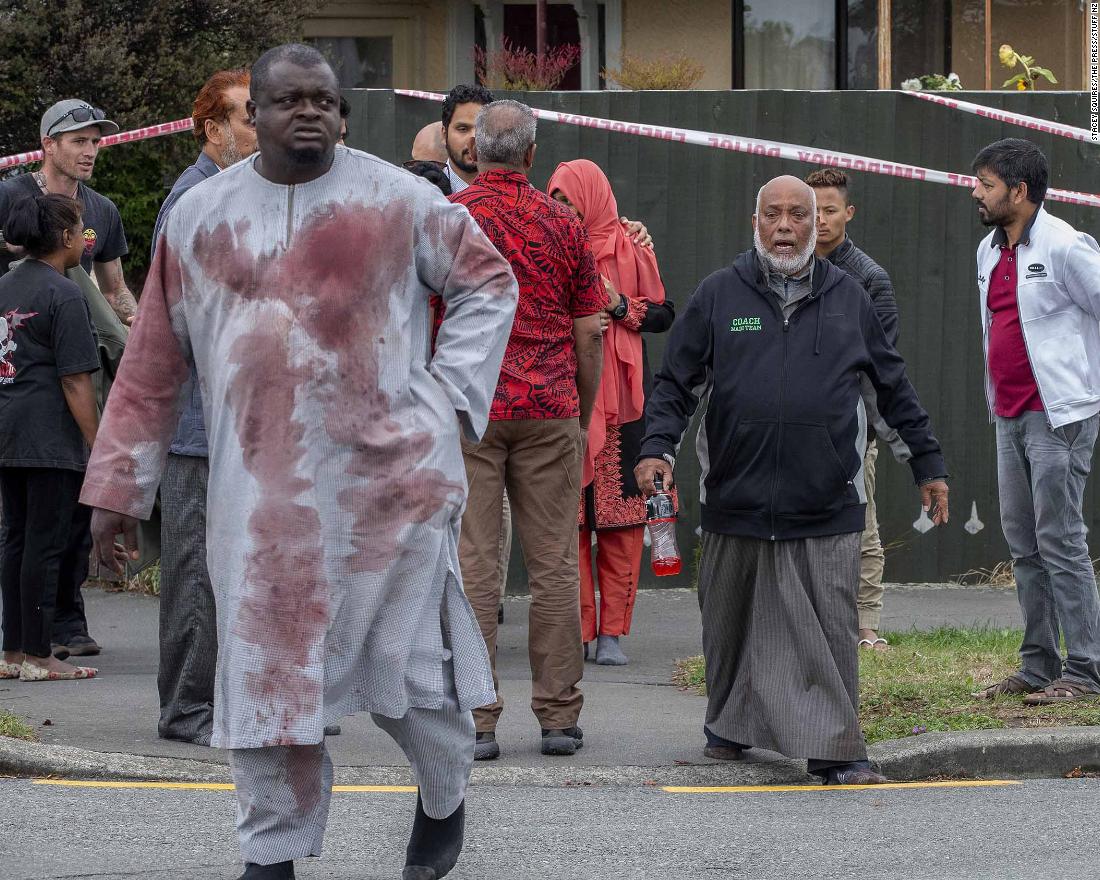A man with blood-stained clothing is seen near the Linwood mosque on Friday, March 15.