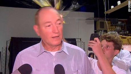 A teenager cracks an egg on the head of Australian Sen. Fraser Anning on Saturday in Melbourne. 