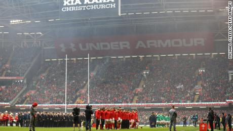 Players observe a minute's silence for the victims of a mass shooting in New Zealand.