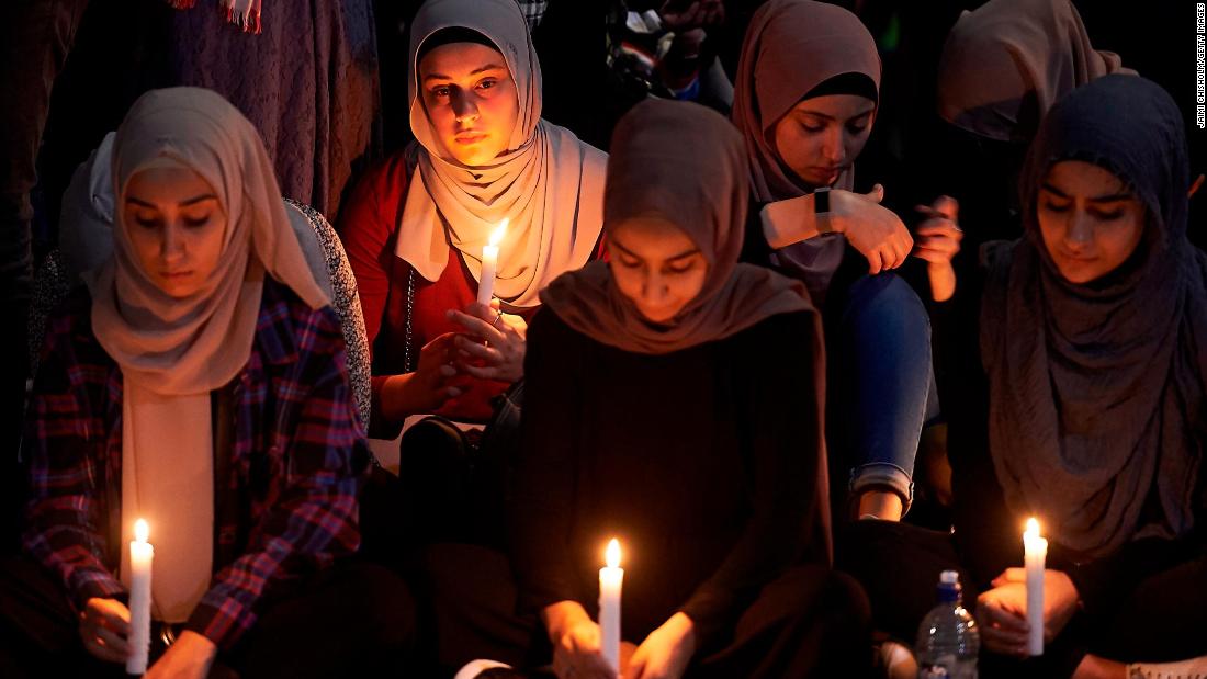 A candlelight prayer is held outside the State Library of Victoria, in Australia, on Saturday, March 16.