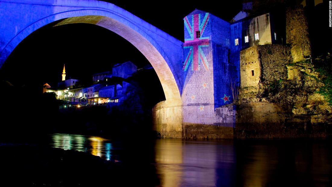 The colors of the New Zealand flag are projected onto the historic Old Bridge over the Neretva River in Mostar, Bosnia-Herzigovina, to commemorate the victims of the deadly mosque attacks in Christchurch.