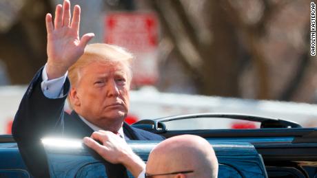 President Donald Trump waves as he boards his motorcade vehicle after he and first lady Melania Trump attend a service at Saint John's Church in Washington, Sunday, March 17, 2019 (AP Photo/Carolyn Kaster)