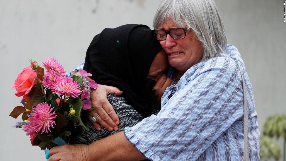 Women embrace near Masjid Al Noor mosque in Christchurch, New Zealand, on March 17.