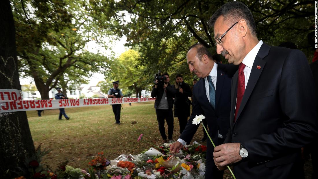 Vice President of Turkey, Fuat Oktay (right), and Minister of Foreign Affairs of Turkey, Mevlut Cavusoglu, lay flowers during their March 18 visit to Al Noor mosque, which was targeted in Friday&#39;s twin terror attacks in Christchurch, New Zealand. 